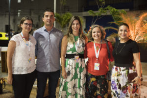 4 women and one man smile at an outdoor reception in Fortaleza, Brazil
